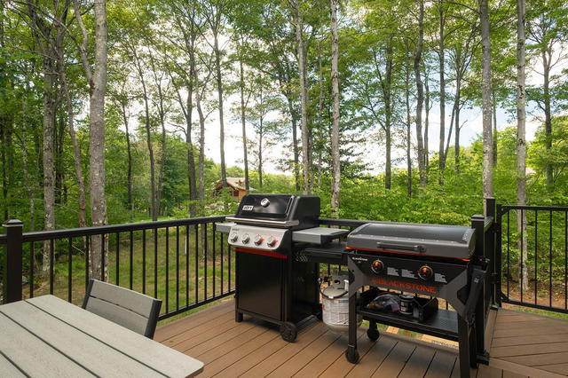 Both grills on the deck: a Weber gas grill and a Blackstone flat-top griddle. St