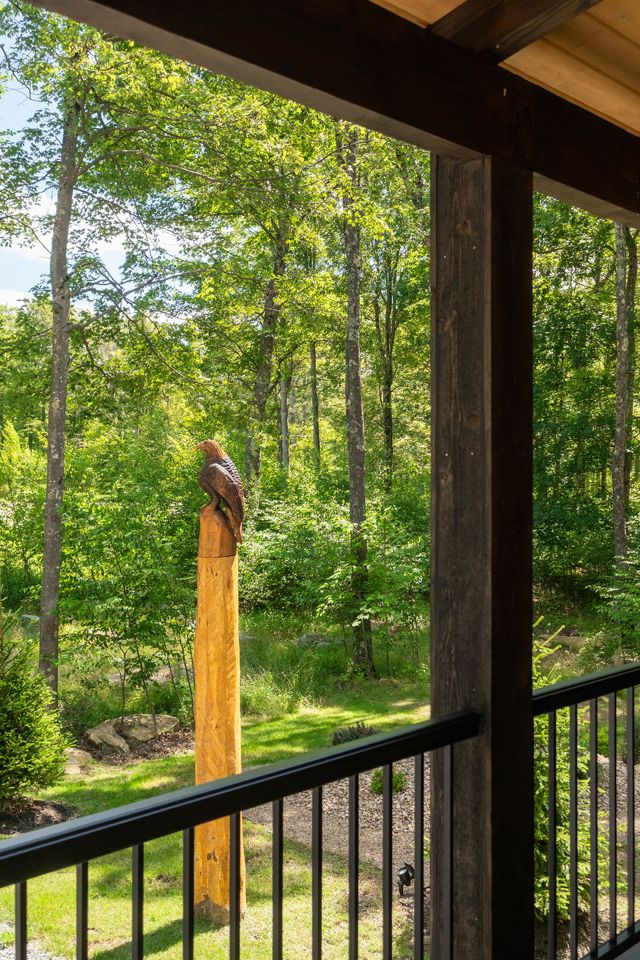The carved eagle that gives the Perch its name, watching from the edge of the po