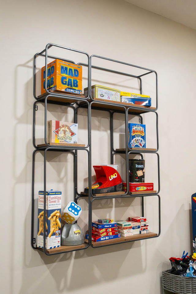 The board game shelf. Somebody always finds the one they played as a kid.