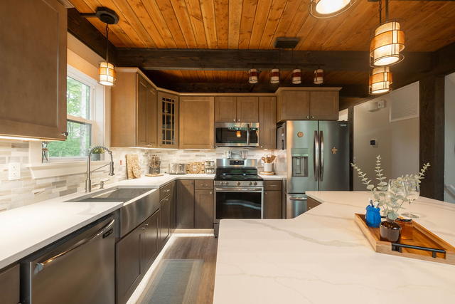 Full-size range, dishwasher and counter run — a kitchen meant for cooking for fo